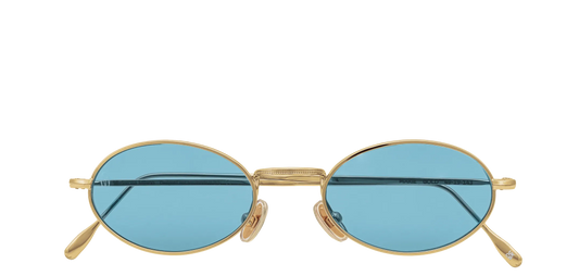 Vista frontale degli occhiali rotondi modello Marie, con montatura oro e lenti color azzurro, chiusi