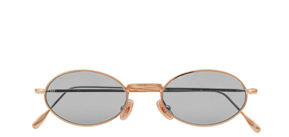 Vista frontale degli occhiali rotondi modello Marie, con montatura oro rosa e lenti color grigio chiari, chiuso