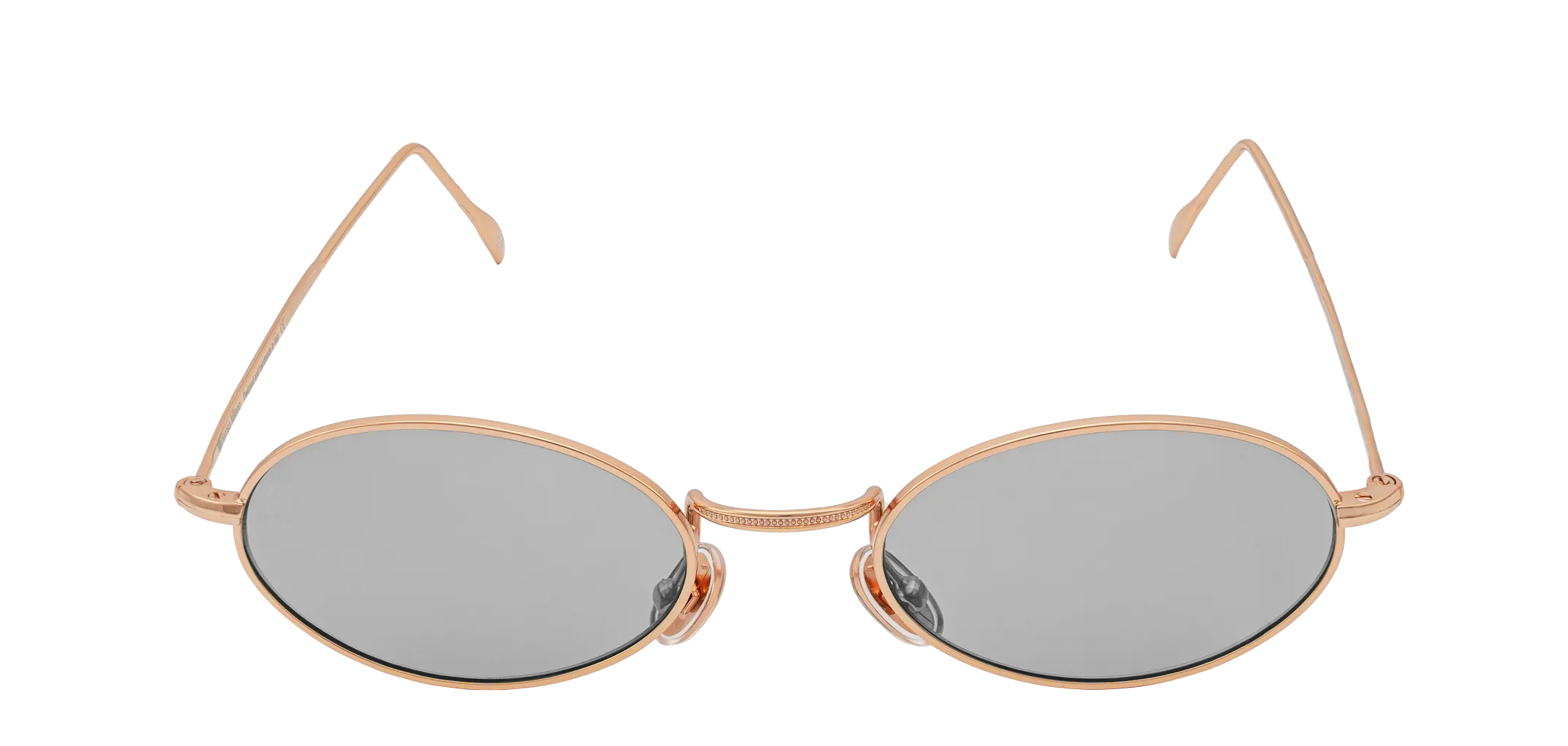 Vista frontale degli occhiali rotondi modello Marie, con montatura oro rosa e lenti color grigio chiari, chiusi
