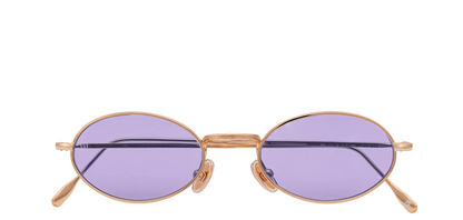 Vista frontale degli occhiali rotondi modello Marie, con montatura oro rosa e lenti color viola, chiusi