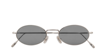 Vista frontale degli occhiali rotondi modello Marie, con montatura argento e lenti color grigio scuro, chiusi